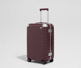 The Aluminum Edge Bigger Carry-On in Oxblood Red
