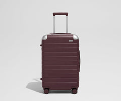 The Aluminum Edge Bigger Carry-On in Oxblood Red