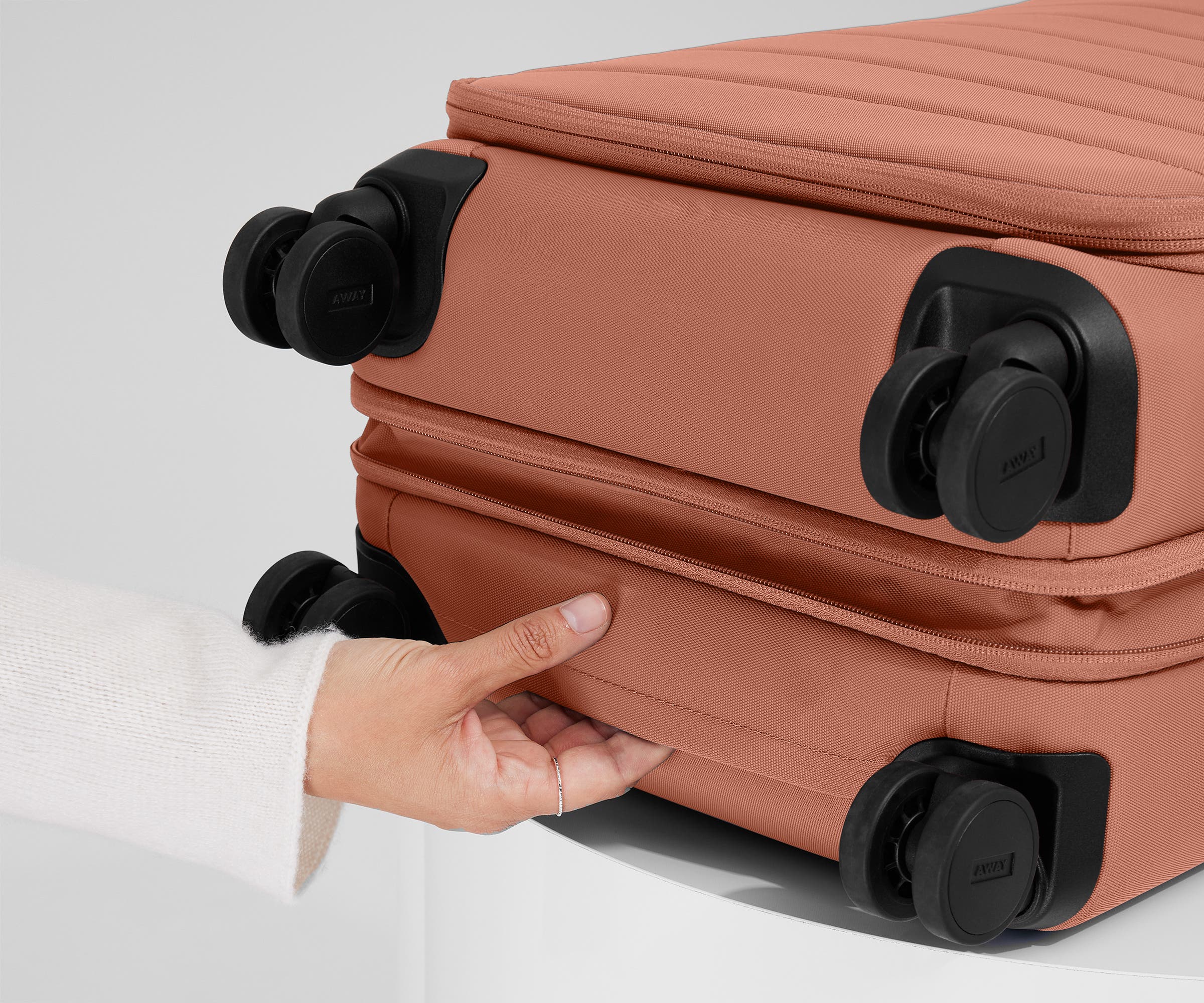 The Softside Carry-On in Clay Pink