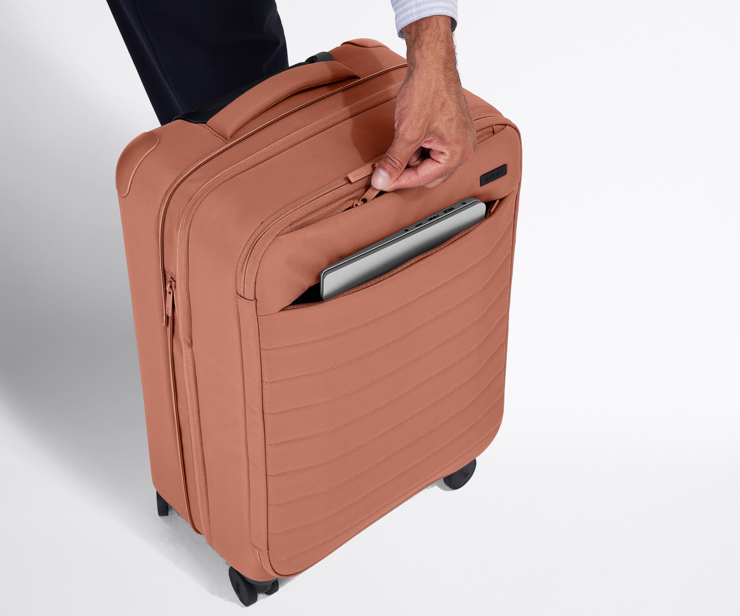 The Softside Bigger Carry-On in Clay Pink