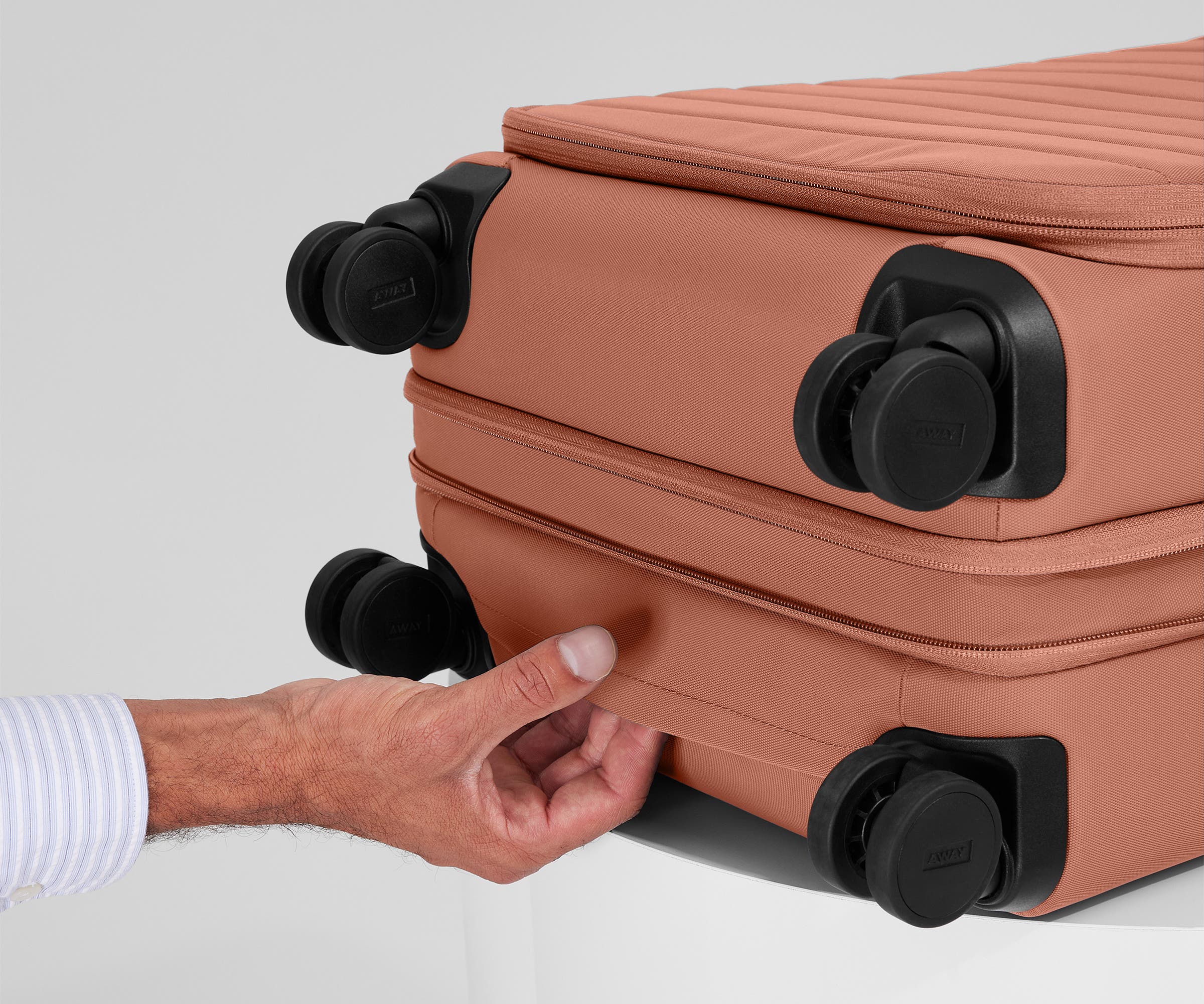 The Softside Bigger Carry-On in Clay Pink