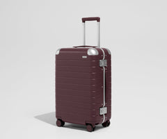 The Aluminum Edge Bigger Carry-On in Oxblood Red