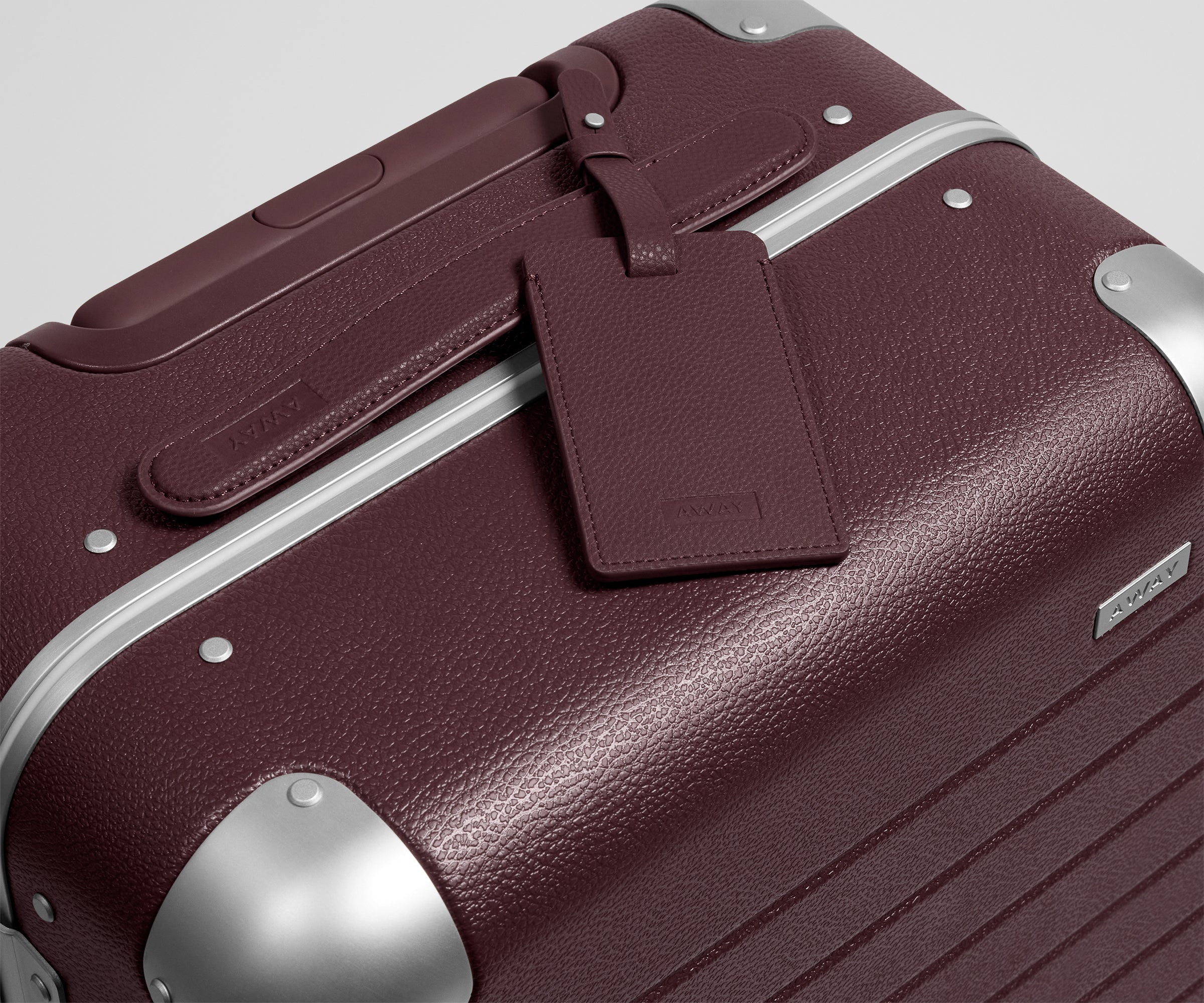 The Aluminum Edge Carry-On in Oxblood Red