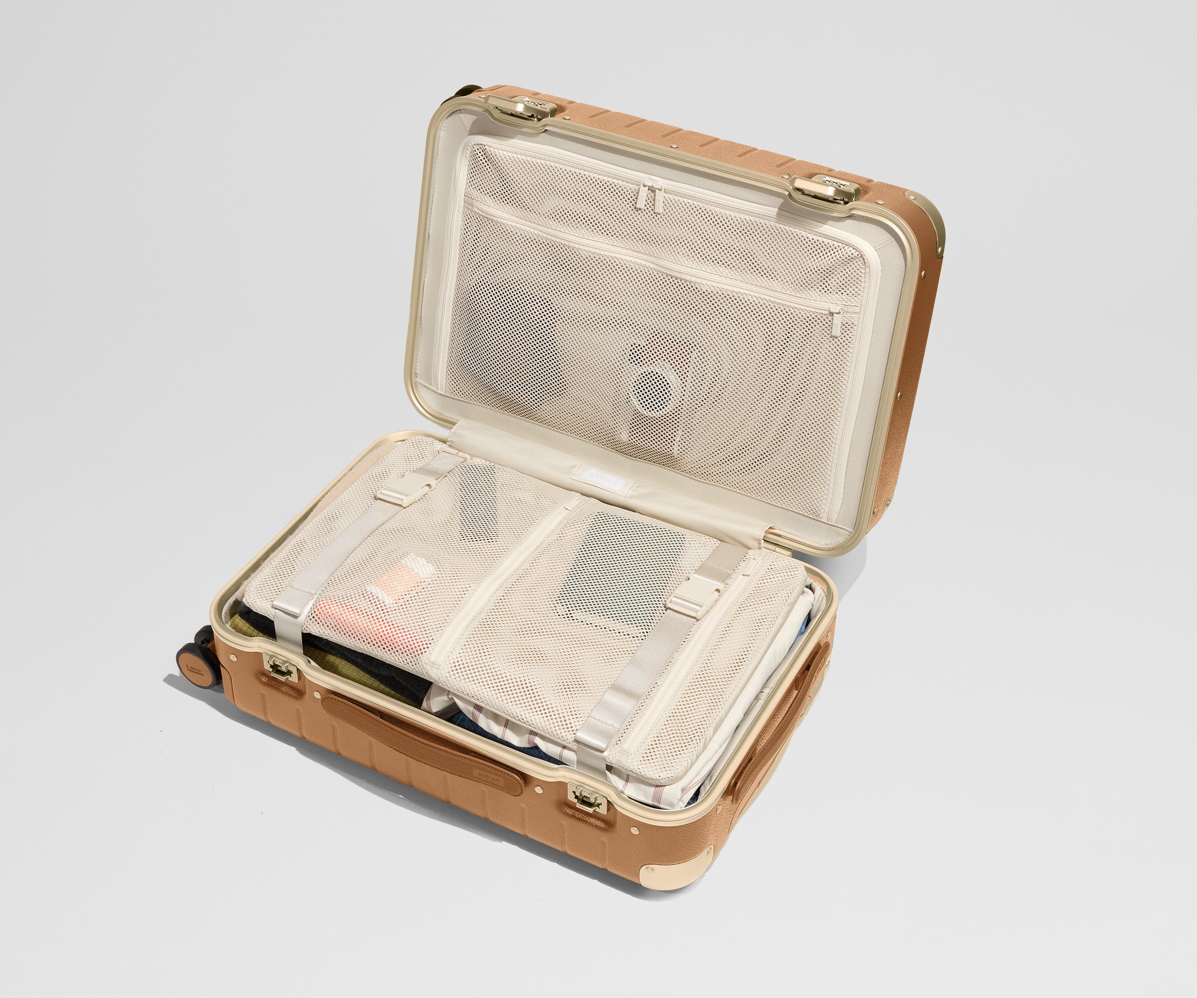 The Aluminum Edge Bigger Carry-On in Cognac Brown