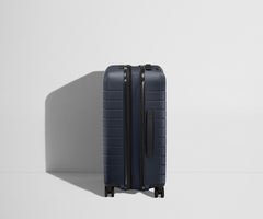 The Bigger Carry-On Flex in Navy Blue