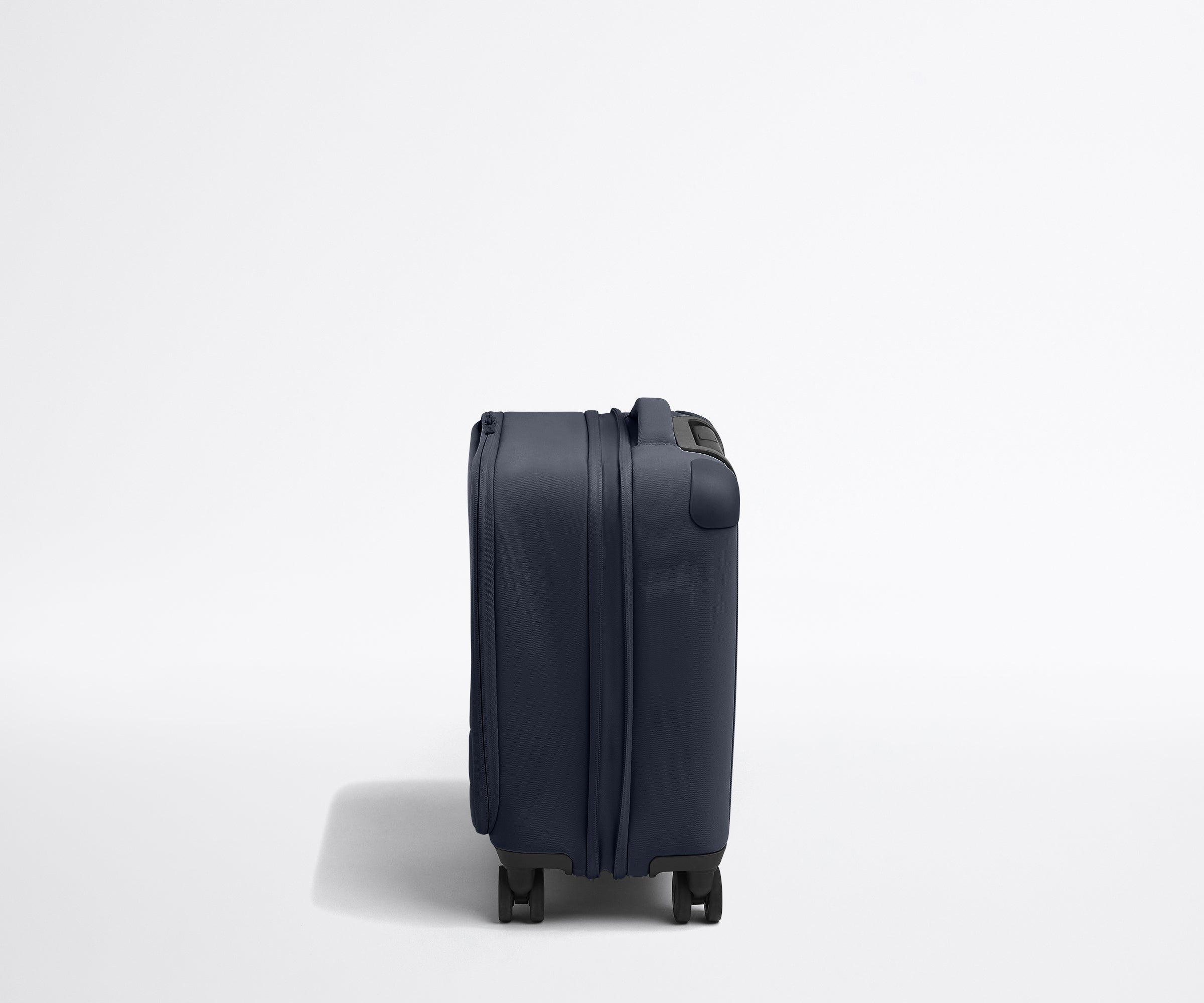 The Softside Compact Carry-On in Navy Blue