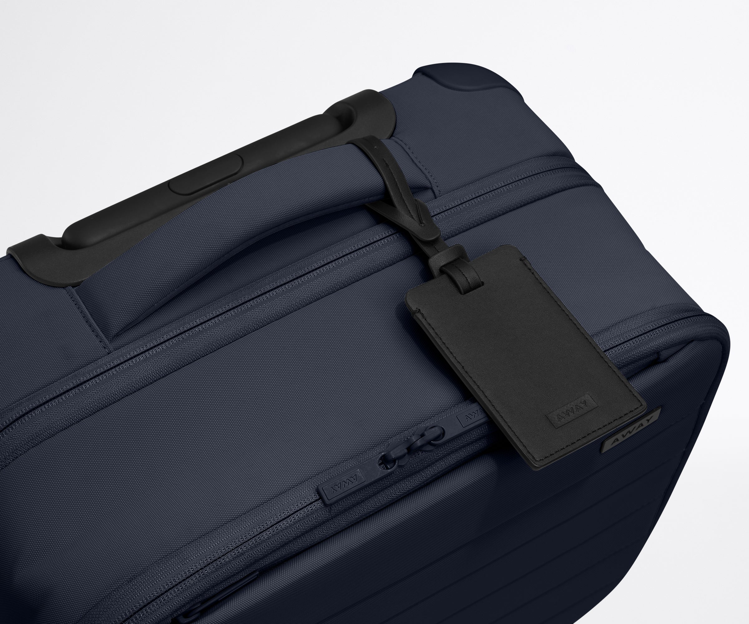 The Softside Compact Carry-On in Navy Blue