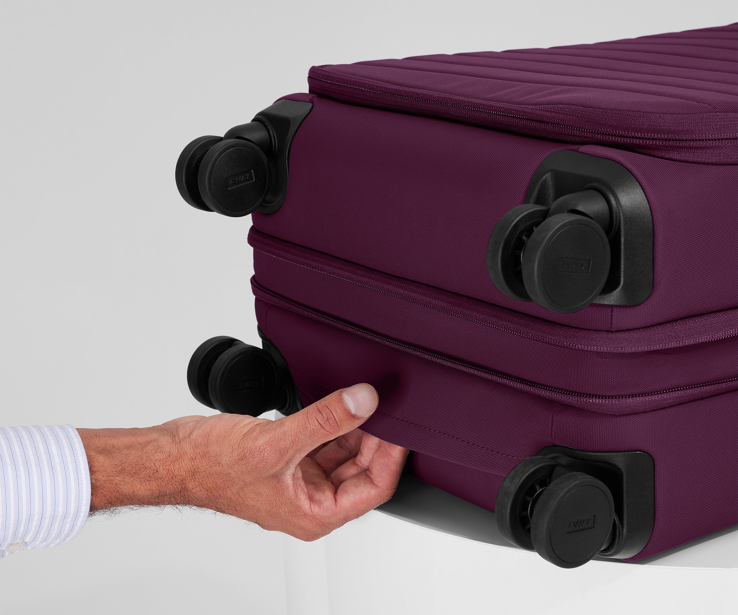 The Softside Carry-On in Plum Purple