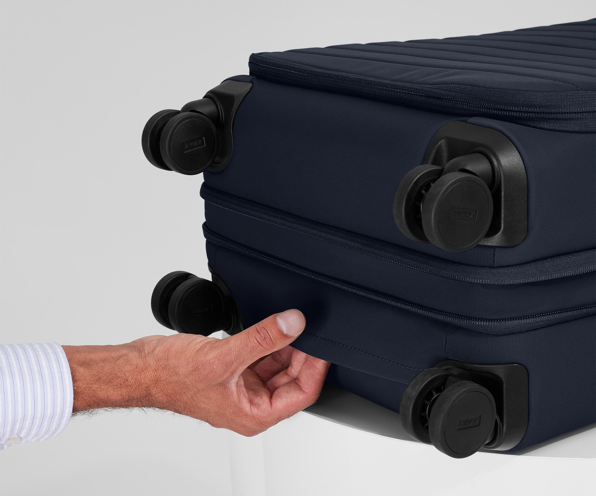 The Softside Bigger Carry-On in Navy Blue
