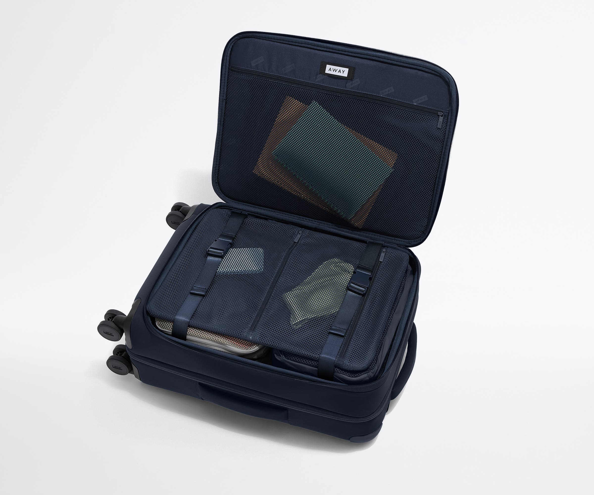 The Softside Bigger Carry-On in Navy Blue